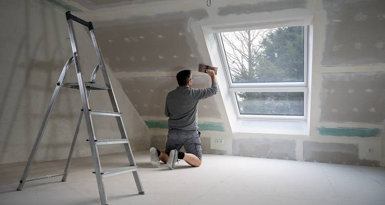 man plastering