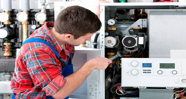 tradesman installing boiler image