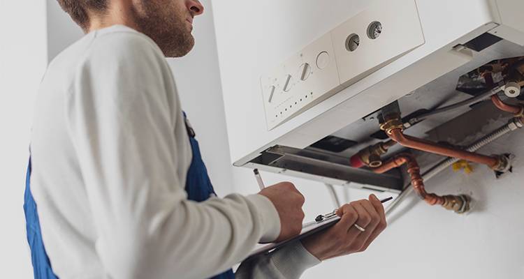 Gas man working on boiler