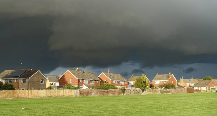 storm clouds over housing estate