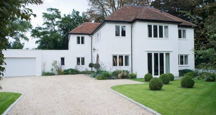 Gravel Driveway with big white house