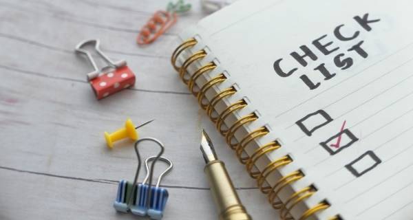Note pad with check list written on