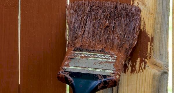 painting fence to treat it