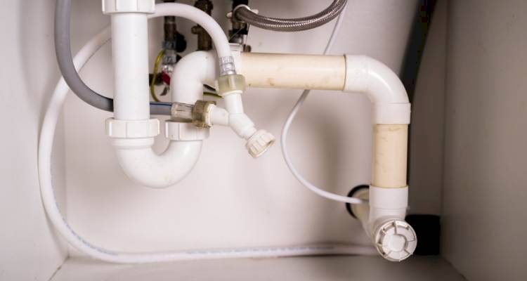 pipes under a kitchen sink