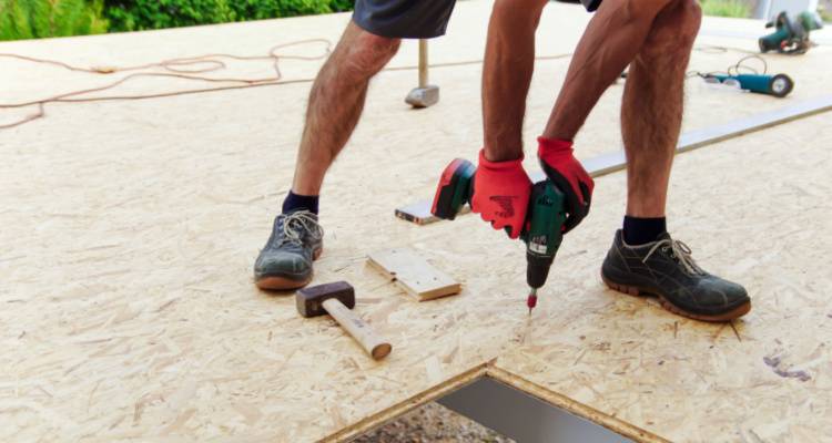 person building a carport