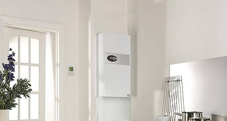 combi boiler installation cost guide — combi boiler installed on the wall of a kitchen