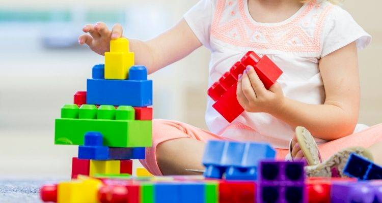 Girl playing with lego