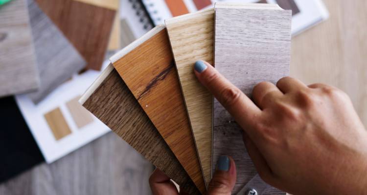 person holding karndean flooring samples