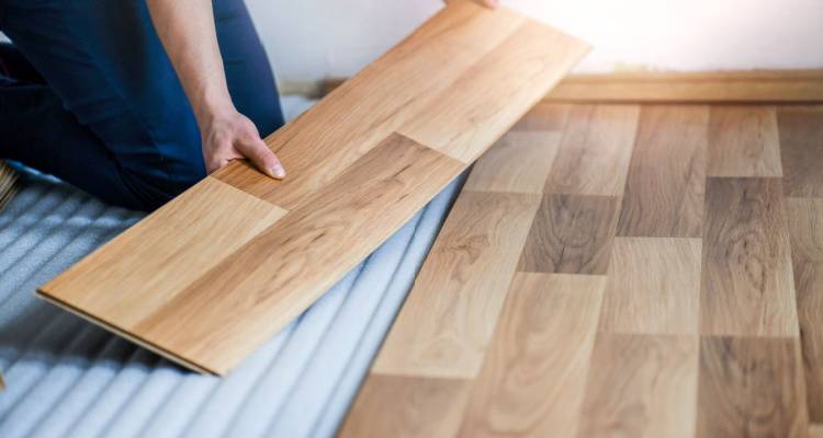 man installing laminate floor