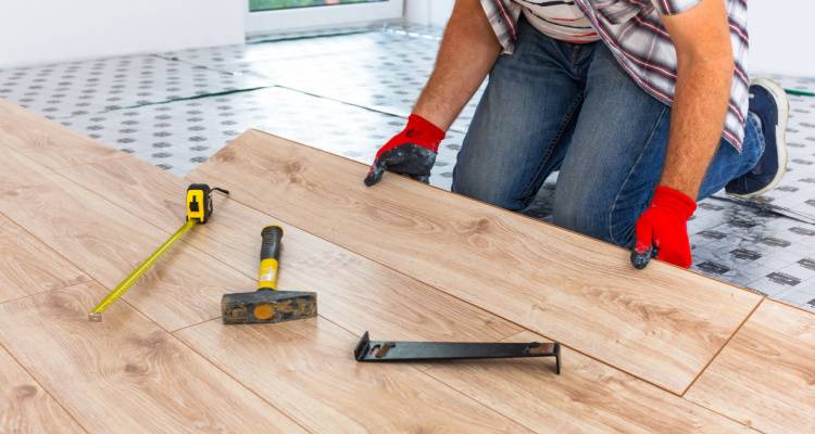 man installing floor