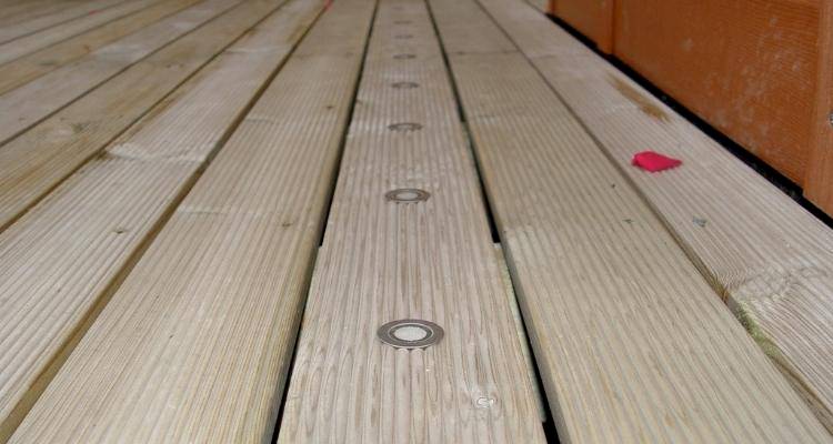 wooden garden decking with lights in