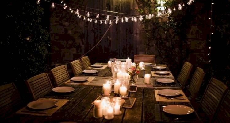 Table in garden with candles as a centre piece