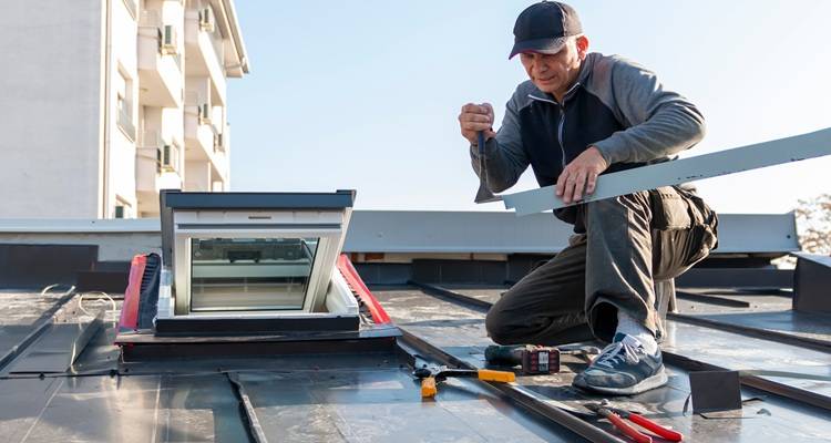man fitting roof