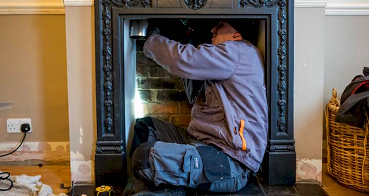 man in fireplace