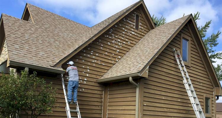 Men painting house