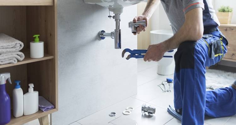plumber with wrench