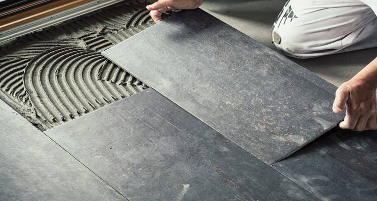 laying bathroom floor tiles