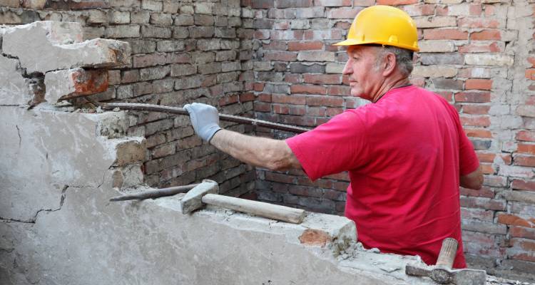 person removing load bearing wall