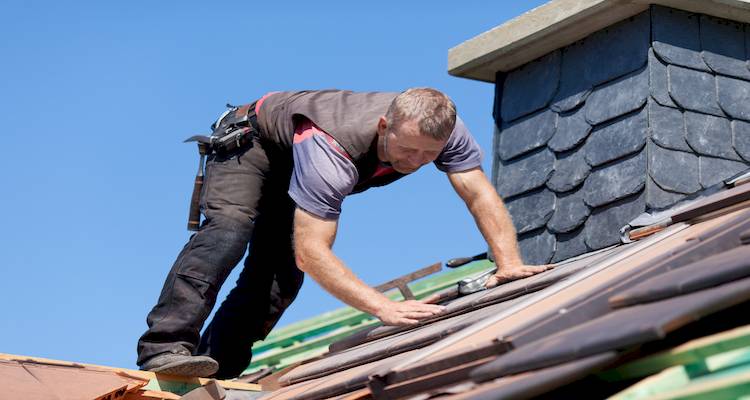 roofing working on a roof in the UK