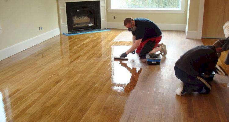 wooden floor specialists treating floor