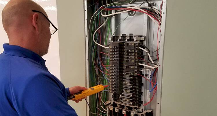 electrician that is testing an electrical system