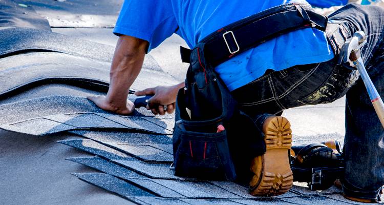 Tradesman repairing a roof