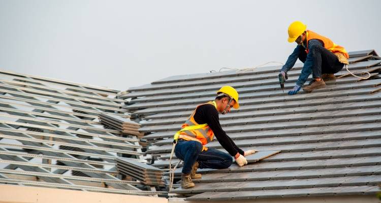 people working on roof