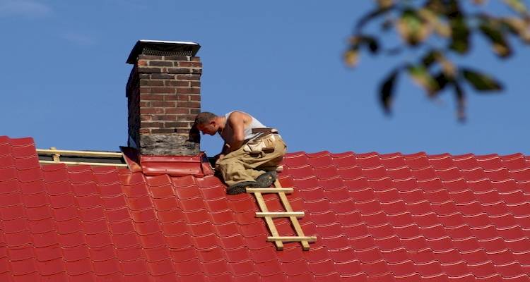 man on red roof