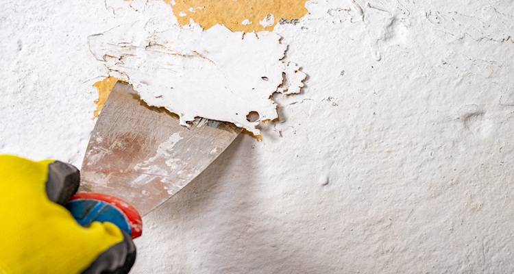 Wall being scraped