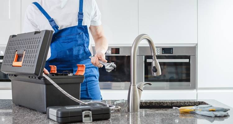 plumber fixing tap