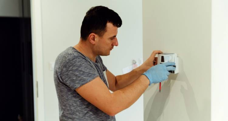 person installing a smart metre