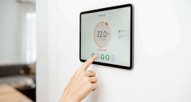 person touching a smart metre