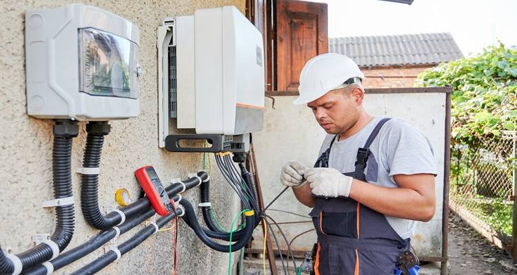 man fitting solar battery