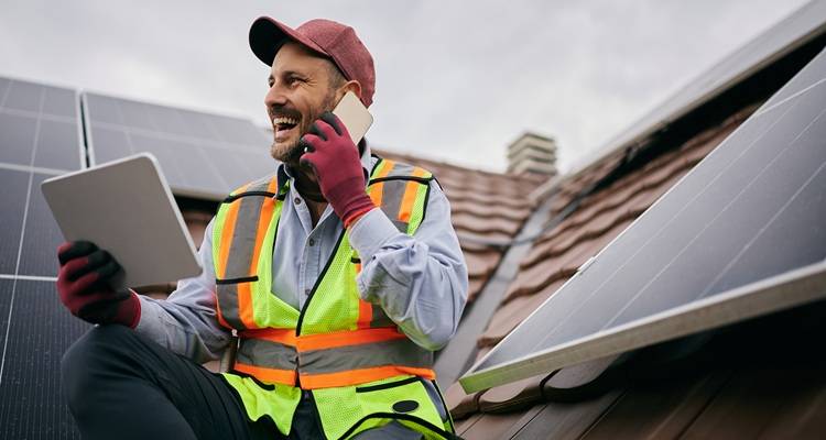 man solar panels roof phone