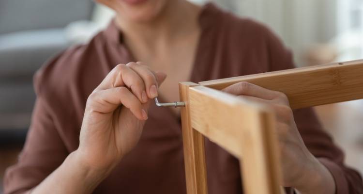 person putting furniture together