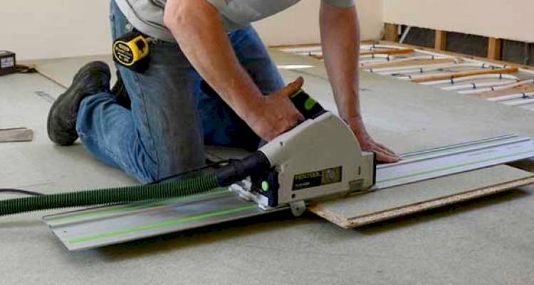 Man installing underfloor heating