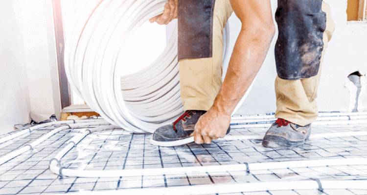 Man laying underfloor heating