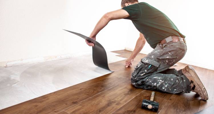 man fitting a floor