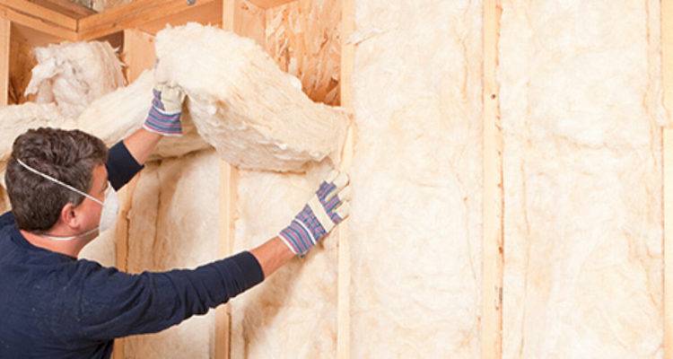 Man installing insulation