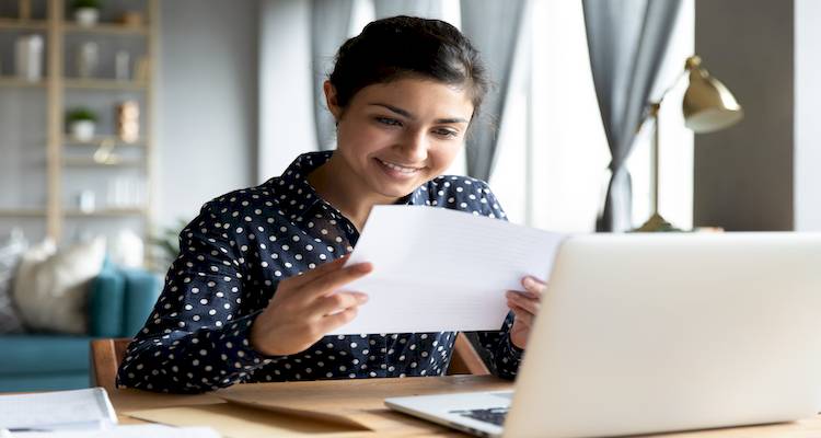 woman receives tax refund image