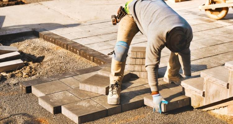 man installing patio