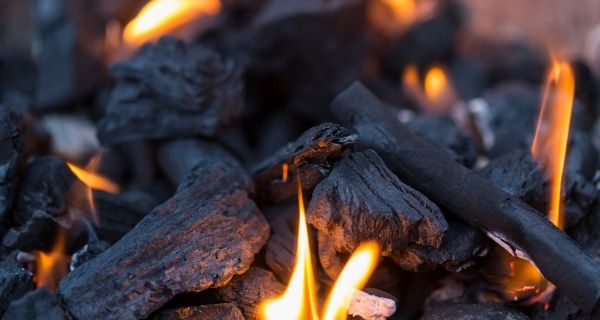 Charcoal burning with flames