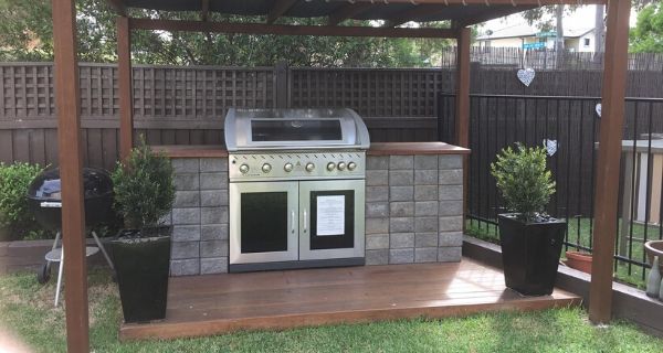 Ultimate garden BBQ area that is also covered. Has a built in gas BBQ and wooden decking area for standing on.