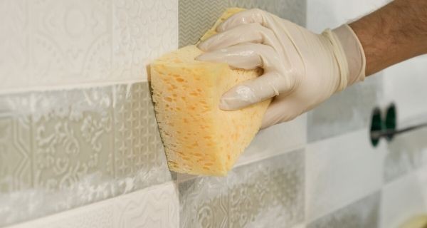 Sponge over fresh grouting from a bathroom upgrade