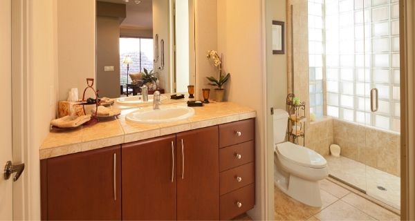 bathroom that has storage under the sink built in as part of a bathroom upgrade