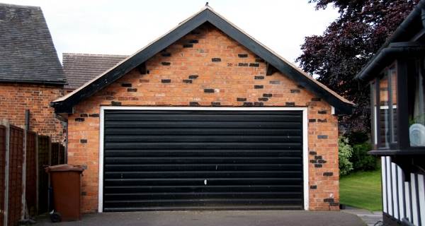 black garage door with pitched roof
