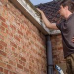 Man inspecting roof