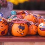 tiny pumpkins with drawn on faces
