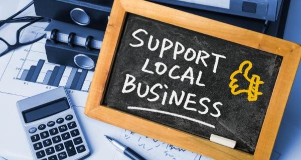 support local written on a chalk board
