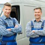 two men outside a van